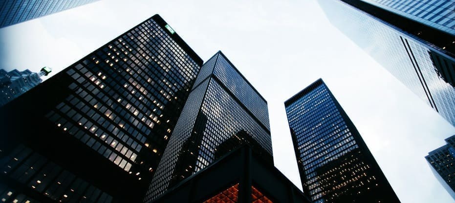 Skyscrapers in a city skyline representing Achilles' role in providing supply chain visibility to Construction companies