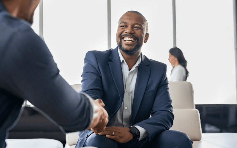 Two men shaking hands in a business deal